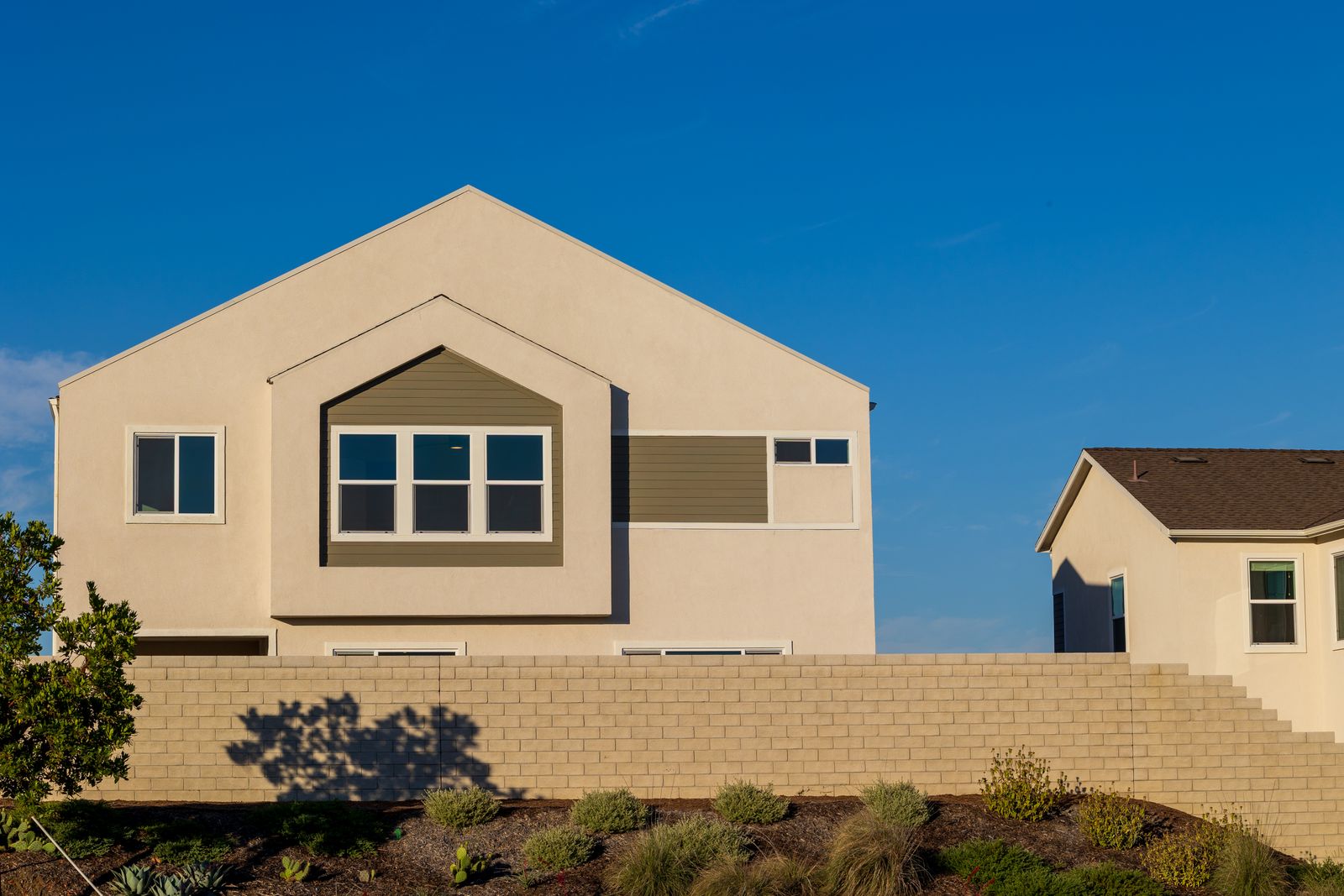Completed new-construction California home under a clear sky